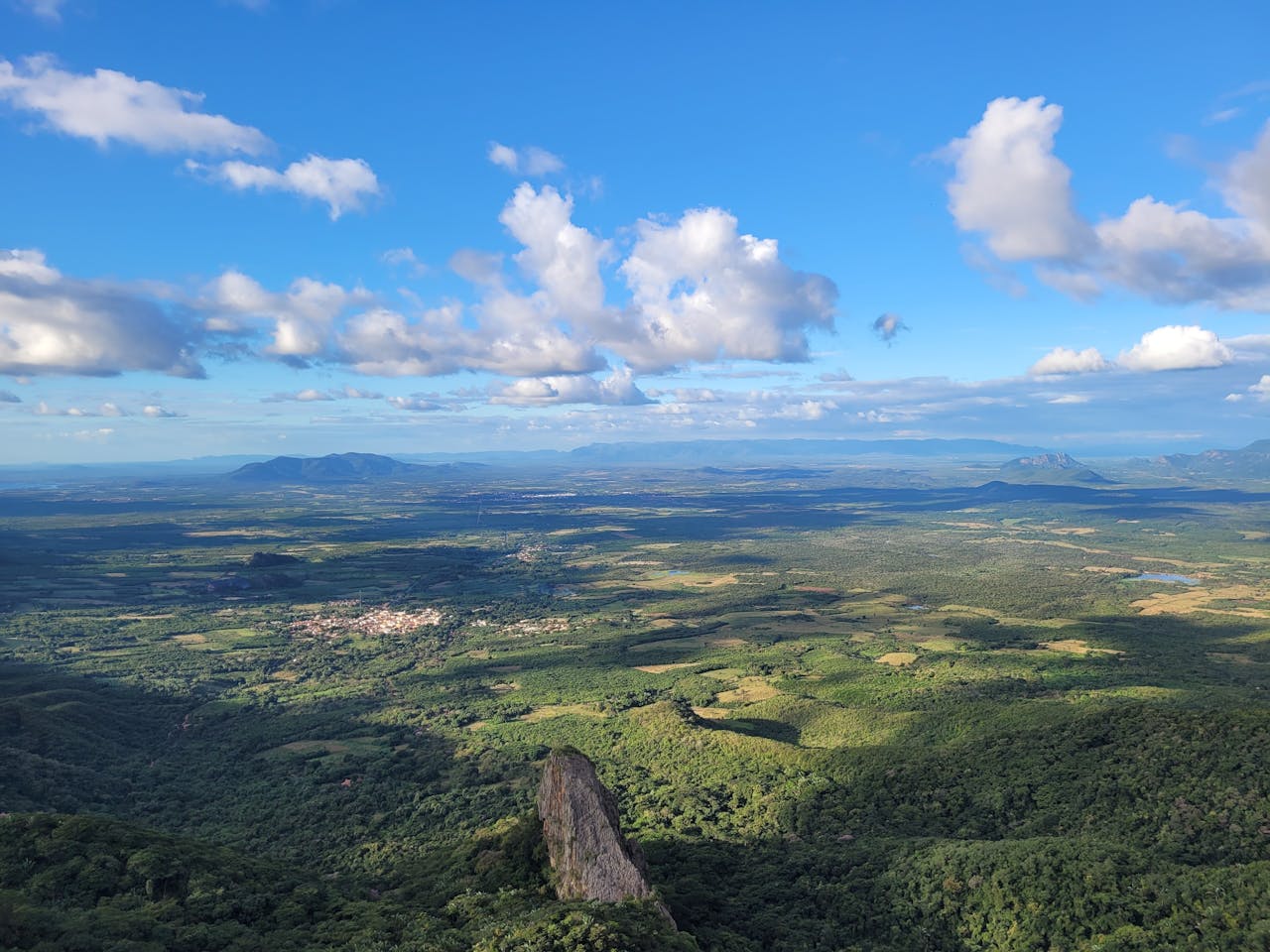 services-03 Breathtaking aerial landscape of Ceará, Brazil, showcasing lush greenery and rolling hills.